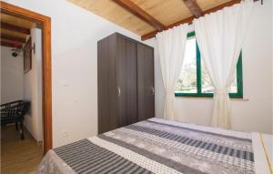 Postel nebo postele na pokoji v ubytování One-Bedroom Holiday Home In Smokvica