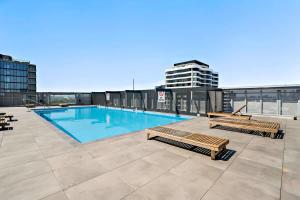 a swimming pool on the roof of a building at Riverina - Ultimate Footscray Getaway with parking in Melbourne