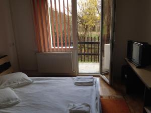 Postel nebo postele na pokoji v ubytování Hotel Romantik