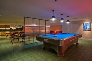 a billiard room with a pool table in it at M Village Hotel Long Biên in Hanoi