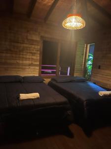 Postel nebo postele na pokoji v ubytování Rancho Forest Guatape