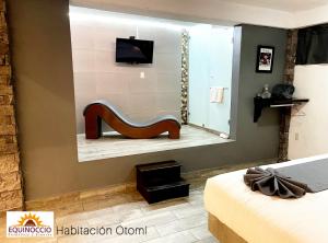 a mirror in a bedroom with a shoe in front of it at Posada Equinoccio in Bernal