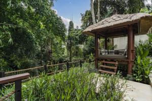 a gazebo in the middle of a garden at Villa Kemalasan by BaliSuperHost in Ubud +20 photos