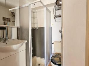 a bathroom with a toilet and a sink at Maisonnette proche plage et forêt, parking, wifi - FR-1-476-230 in La Faute-sur-Mer