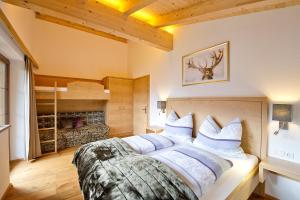 Posteľ alebo postele v izbe v ubytovaní Superior Chalet Tiroler Madl