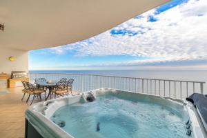 a jacuzzi tub on the balcony of a house at Turquoise Place 2205 C in Orange Beach