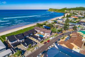 an aerial view of a town and the beach at Absolute Beachfront Apartment 11B in Lennox Head
