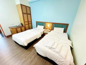 Voodi või voodid majutusasutuse The Paramount Hotel Sibu toas
