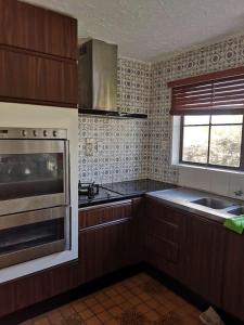 Kuchyň nebo kuchyňský kout v ubytování Cozy 安逸舒适小屋