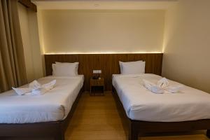מיטה או מיטות בחדר ב-Hotel Dashain