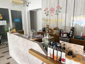 a store with bottles of wine on a counter at Florens Inn in Yogyakarta