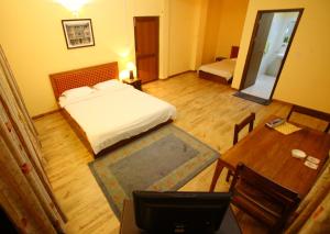 Letto o letti in una camera di Royal Astoria Hotel