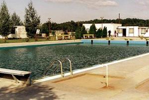 a large pool of water with a bench in it at Alba Regia Pansion Egri in Jahodná