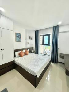 Postel nebo postele na pokoji v ubytování Thủy Tiên-Thạch Thảo