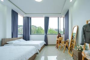 Postel nebo postele na pokoji v ubytování Thủy Tiên-Thạch Thảo