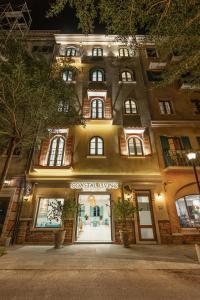 a store front of a building at night at Coastal Living Hotel Phu Quoc - Free Ticket Cable Car & Hon Thom Water Park in Phu Quoc