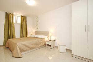 Posteľ alebo postele v izbe v ubytovaní House Gorica 2 - underground level apartments