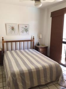 Säng eller sängar i ett rum på Frente Para O Mar