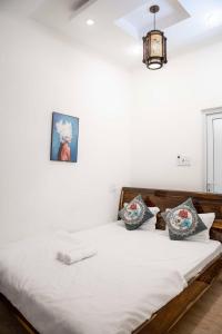 Postel nebo postele na pokoji v ubytování Thủy Tiên-Thạch Thảo