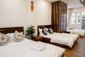 Postel nebo postele na pokoji v ubytování Thủy Tiên-Thạch Thảo