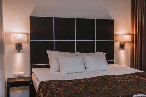 Postel nebo postele na pokoji v ubytování Pärnu Hotel