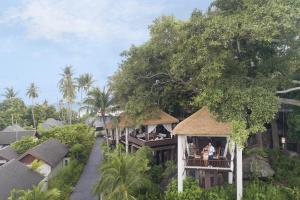 arial view of a resort with people on a balcony at Anantara Lawana Koh Samui Resort in Chaweng