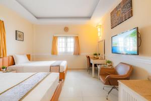 Postel nebo postele na pokoji v ubytování Fortune 1127 - Central Hotel