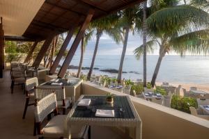 a restaurant with a view of the beach at Anantara Lawana Koh Samui Resort in Chaweng