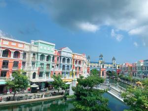 a group of buildings next to a river at Mila Homstay in Phú Quốc