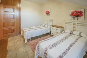 Posteľ alebo postele v izbe v ubytovaní Puerta Villa