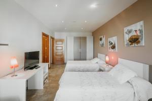 Posteľ alebo postele v izbe v ubytovaní Puerta Villa
