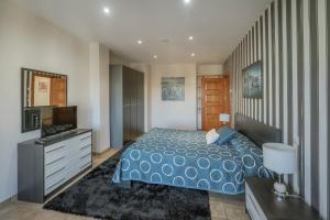 Posteľ alebo postele v izbe v ubytovaní Puerta Villa