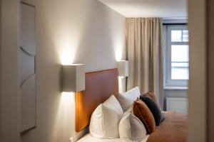 Postel nebo postele na pokoji v ubytování Hotel Goldene Steig