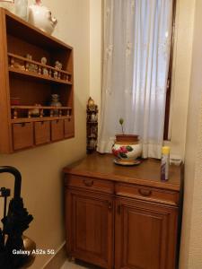 a room with a wooden cabinet with a window at #Punto FM 7# in Marghera +23 photos