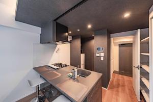Kuchyň nebo kuchyňský kout v ubytování 大阪難波河畔花园酒店702