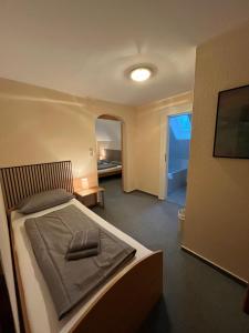 Postel nebo postele na pokoji v ubytování Hotel Mühleneck