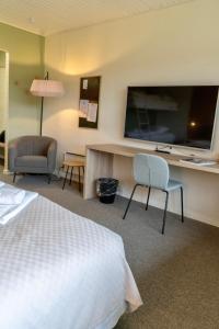 Letto o letti in una camera di Strandhotel Klitrosen