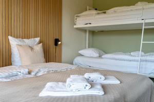 Letto o letti in una camera di Strandhotel Klitrosen