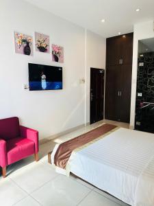 Postel nebo postele na pokoji v ubytování Ngoc Linh Luxury Hotel
