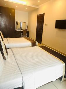Postel nebo postele na pokoji v ubytování Ngoc Linh Luxury Hotel