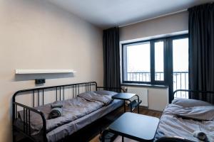 Postel nebo postele na pokoji v ubytování Rikap Coliving Spaces + 37 fotografií