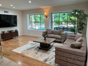 a living room with two couches and a coffee table at Porter Paradise in Deer Lake Highlands