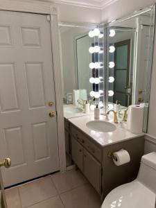 a bathroom with a sink and a mirror at Porter Paradise in Deer Lake Highlands