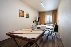 TV a/nebo společenská místnost v ubytování Rikap Coliving Spaces