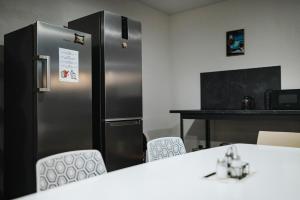 TV a/nebo společenská místnost v ubytování Rikap Coliving Spaces