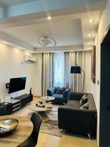 a living room with a couch and a table at pierre de lune in Kinshasa