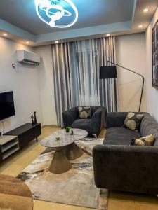 a living room with a couch and a table at pierre de lune in Kinshasa