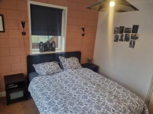 Postel nebo postele na pokoji v ubytování vakantiehuis en appartement De Harscamp