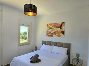 Ένα ή περισσότερα κρεβάτια σε δωμάτιο στο Sunny Beach Apartments - 273