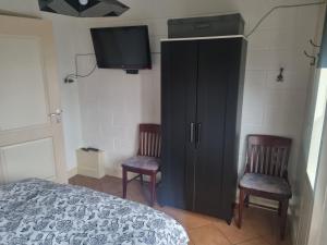 Postel nebo postele na pokoji v ubytování vakantiehuis en appartement De Harscamp